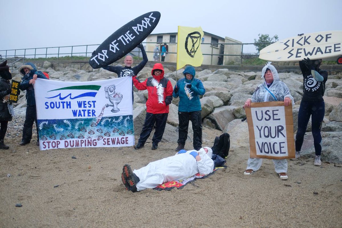 XRSouthWest's tweet image. Protestors in Penzance yesterday at Long Rock beach, which is the site of a @SouthWestWater sewage outlet. It was marked 'unsafe to swim' because of poo-llution💩. #cutthecrap #dirtywater #dirtyprofits Photos: Gavan Goulder  @Feargal_Sharkey