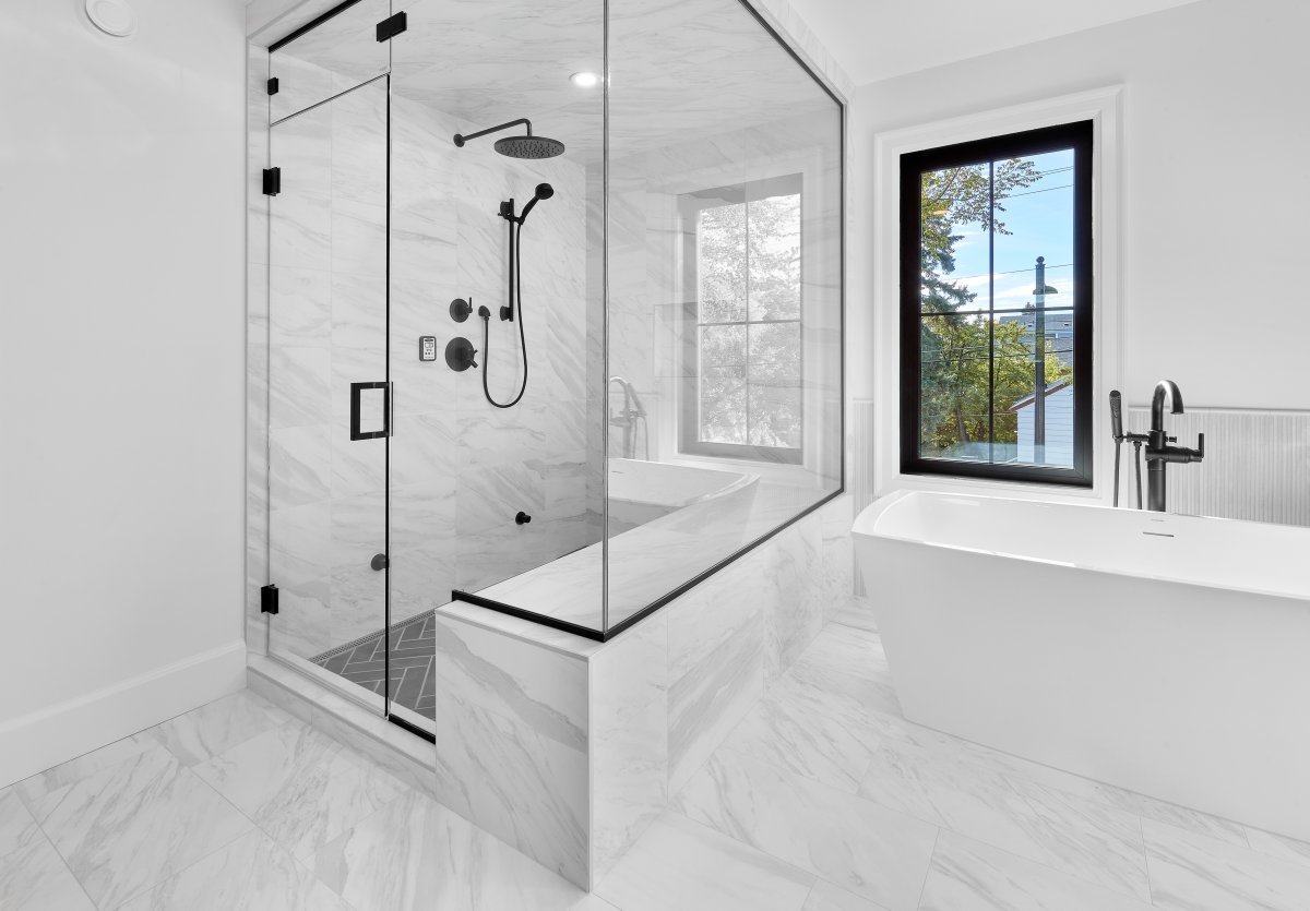 Ensuite Goals 🖤 

We can't get over how stunning this Ensuite is in our client's custom home. The seamless &amp; airy marble paired with a classic herringbone shower floor and black finishes. Perfection.