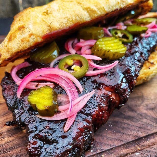 EasyHowToBBQ's tweet photo. The McRib on Fire!  Homemade Pickled Onions and Jalapeños.  Slathered with Sweet Lady Love BBQ Sauce from @bestdamnbbqsauce 

Full Credit @eatwithme_xyz 
 #bbqlunch #bbqlads #bbqlove #bbqislife #bbqideas #bbqhacks #bbqguys #bbqguru #bbqfun #bbqfam https://t.co/GVj9VfuP63