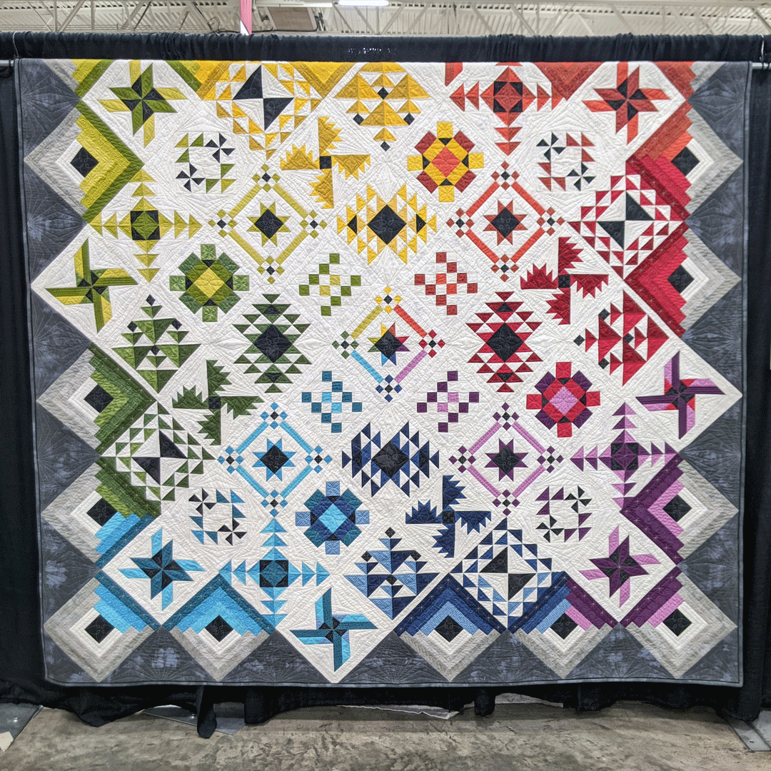 WIQuiltShow's tweet photo. "Heritage Square," created by Becky Zajac of Cherry Valley, Illinois and quilted by Irene Delay of Happy Fun Quilts, entered in the 2022 Quilt Contest, Machine Quilted Bed Size - Pieced category. Pattern/design source: "Heritage Square" by Chris Hoover #WisconsinQuiltShow https://t.co/P1ISOeapGO