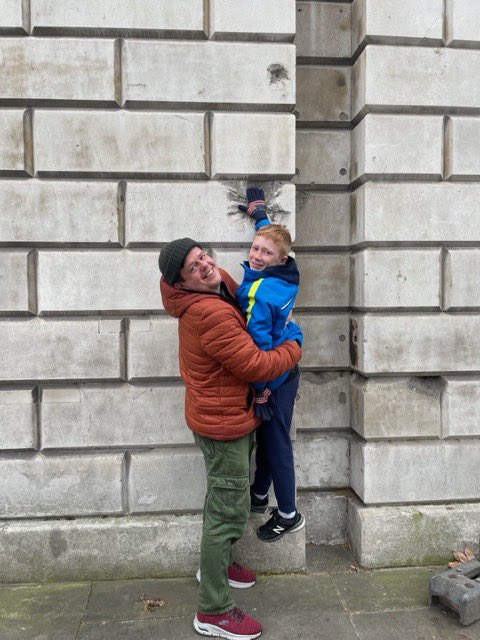 OldEnglandTours's tweet photo. My little Canadian tourist today kept trying climb but failing to reach this big WW1 bombshell shrapnel hole so I thought I’d help out. Another happy customer whose had the best day of his life #tours #London #walkingtour #privatetour #visitlondon https://t.co/Sd5BszONAg