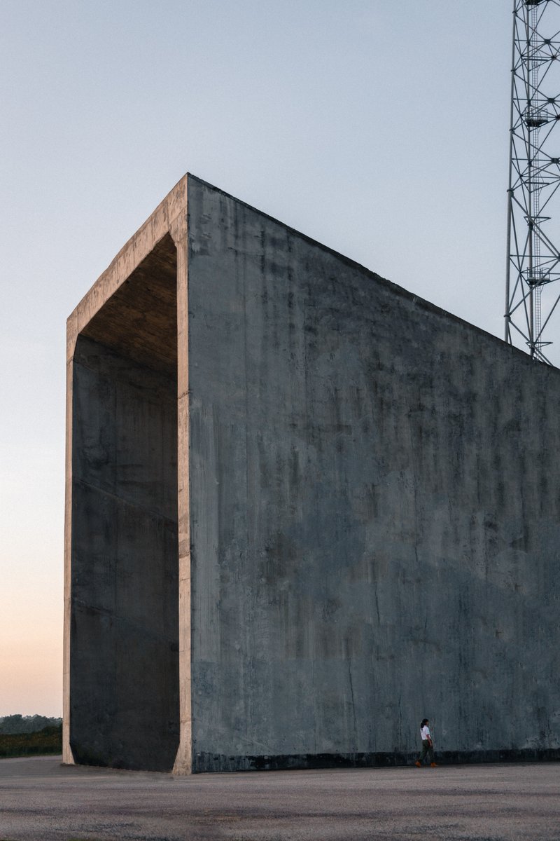 The Future is Female! This is one of our colleagues in front of Ariane 6's flame trenches. These concrete channels are designed to evacuate exhaust gases produced by the engines at lift-off. How much heat in °C can they withstand?
📸<a href="/withCharlyG/">Charly G.</a>  #ArianeGroupSpaceWomen
