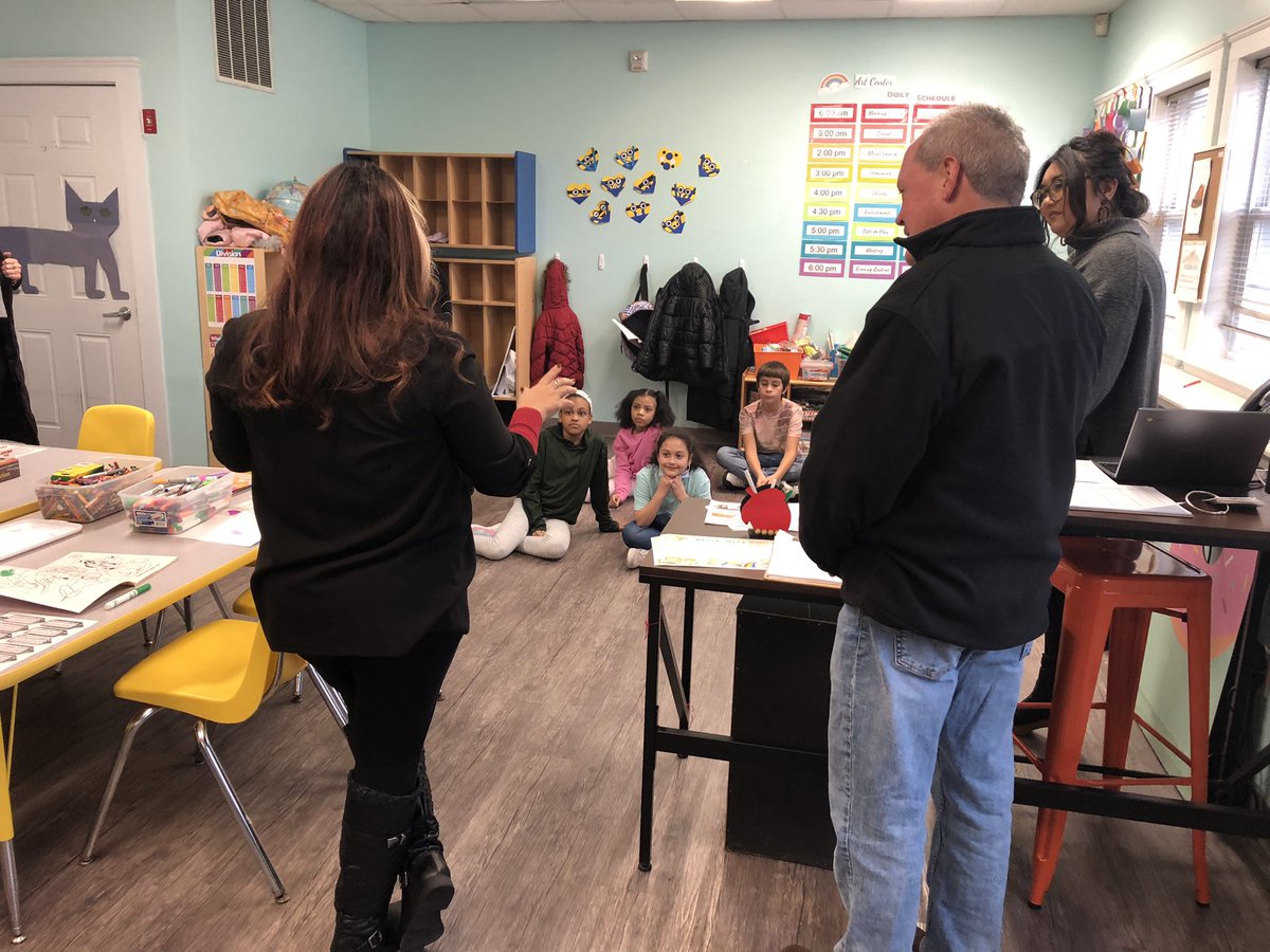 HousingNetwrkRI's tweet photo. Woonsocket City Councilors Valerie Gonzalez and David Soucy stopped by The Art Center (run by @NWBRV) today, giving a quick civics lesson to the kiddos. Pictured: Gonzalez explains how the City Council works in Woonsocket. #RICDCweek #CommunityDevelopment https://t.co/C1GmDA6Vyl