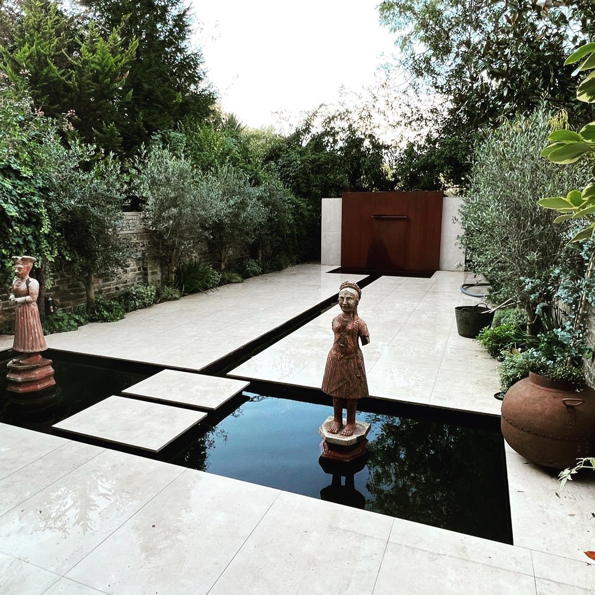 Recently finished formal koi pond, rill and Cor Ten water wall in Maida Vale