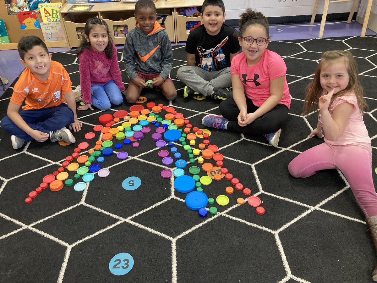 Maria_KimeK's tweet photo. I’m lucky ☘️because I teach these amazing, creative kindergarteners! Our morning work this week has a St.Patrick’s Day theme. We are sorting lids to make a rainbow and rolling dice to build ☘️ shamrocks.  What can you build with repurposed lids?  @HeritageECS #HECSmagic https://t.co/L6EAUmoN6g