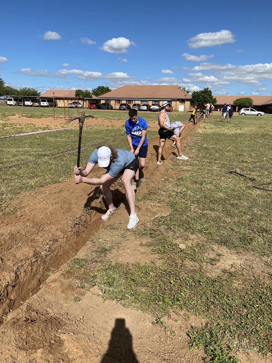 ChaplainMarty's tweet photo. Still no bags have arrived but we are living on two t-shirts and two pairs of shorts!  We dug a water line ditch and put in the line.  Guys were power workers!  BoilerUP https://t.co/2Id7X95Yd3