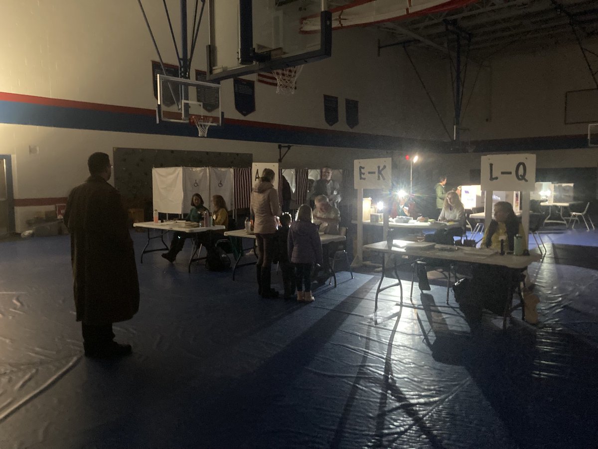 It’s voting by battery-powered lamp and flashlight in Weare, where the power is out.