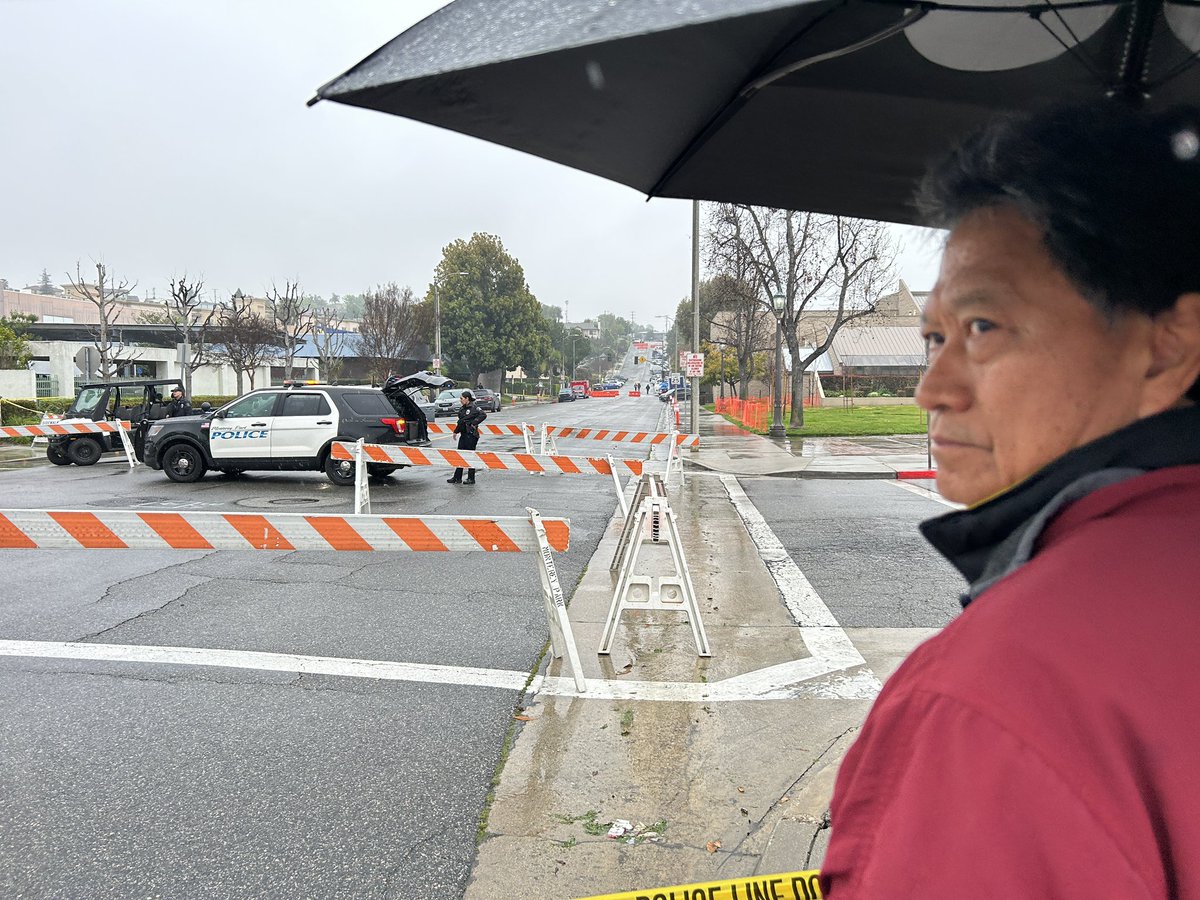 vidcrane's tweet photo. #MontereyPark residents wait on the rain for the arrival of President #Biden Tuesday. #Biden will announce a new executive order on #Guncontol https://t.co/B76C3Ut08X
