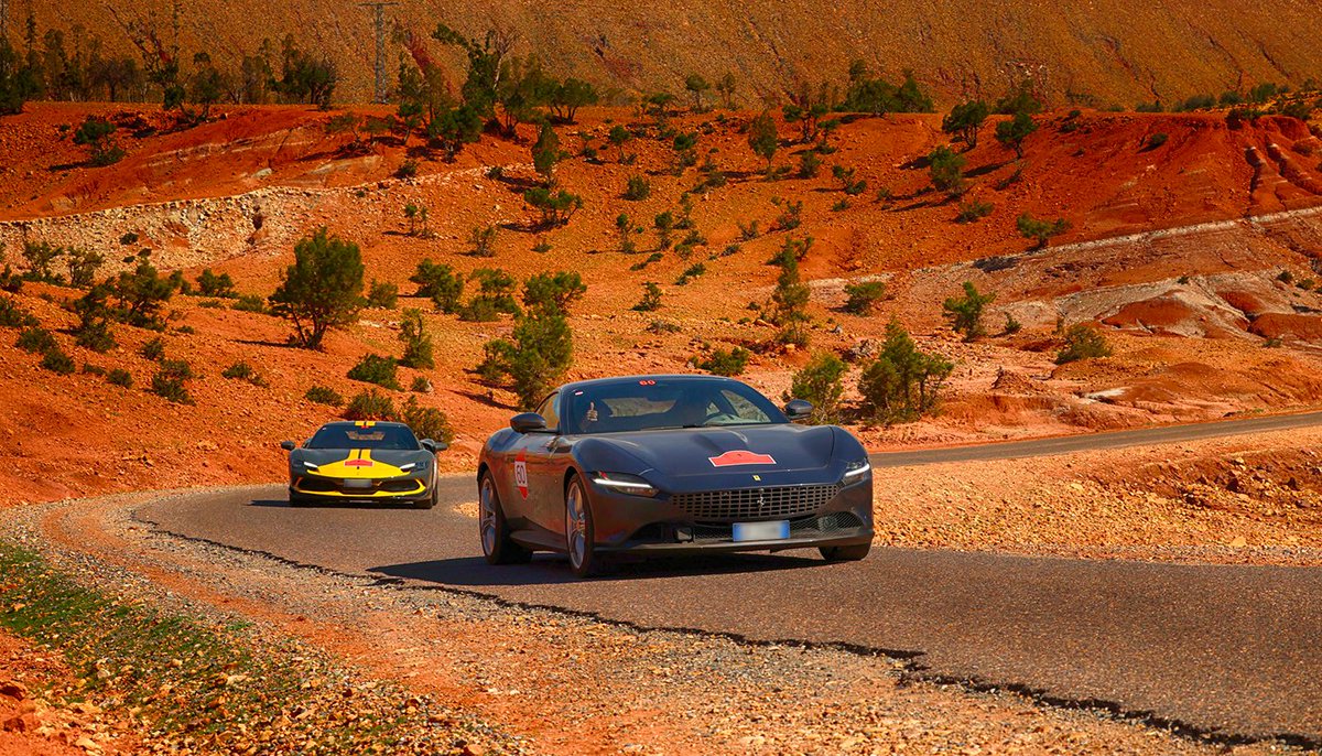 Ferrari's tweet photo. Immerse yourself in rich, bright hues with the #FerrariCavalcade in #Morocco. Over 80 participants set off to the discovery of ancient cities, the soaring Atlas mountains and sweeping desert roads in this truly unforgettable driving experience. 
#DrivingFerrari #Ferrari https://t.co/Nh2QP0DwBU