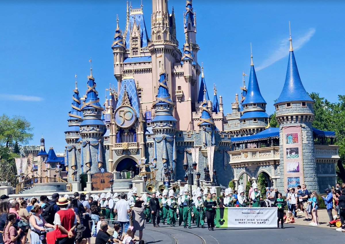 DerbySchoolsKS's tweet photo. It's a beautiful day to march at Disney World's Magic Kingdom! 

We are proud of Derby High School Marching Band's hard work and hope you have all had the best week at Disney. Thank you to everyone who supported the band through their fundraising efforts. https://t.co/gRWyd4w2It