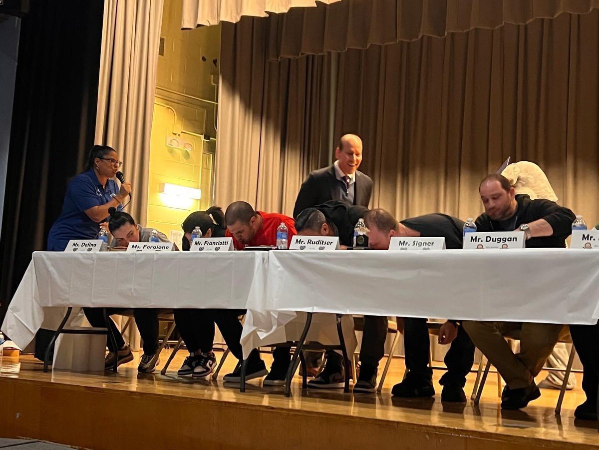 BELLAcademy's tweet photo. BELL Academy and P.S. 169 teachers go head-to-head in a pie eating contest in recognition of Pi Day!  A fun and competitive way to discuss the importance of Pi in mathematics!   Congrats to Ms. Rizzo, for dominating the competition and proudly representing BELL! #BELLStrong! https://t.co/SYFiZrxpz9