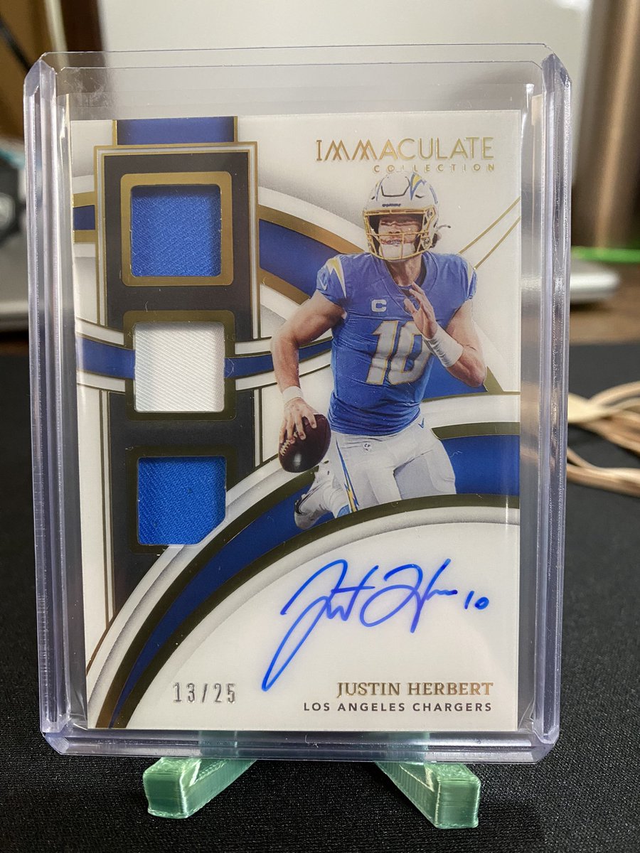 __ShaneTrain__'s tweet photo. @HobbyConnector Would you have this graded, or sell it raw? 2022 Immaculate Triple Patch on card Auto Justin Herbert 13/25 https://t.co/AgM0FRJZ8C