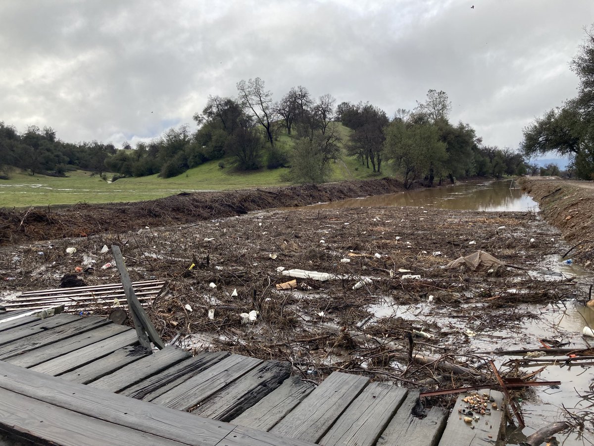 Debris has flowed into a bridge over the A.C.I.D canal, which is overflowing south of Redding.