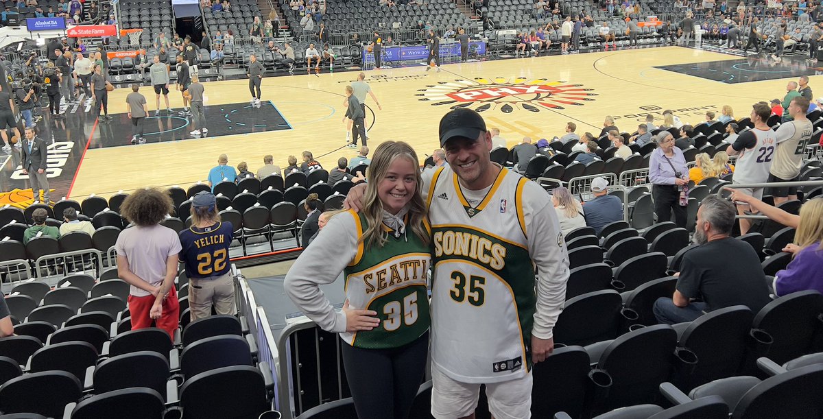 MissingSonics's tweet photo. Our first Suns game and proof that I raised her well. Bring back the Sonics and get well @KDTrey5! #ASUDad https://t.co/l9cFIabwBa