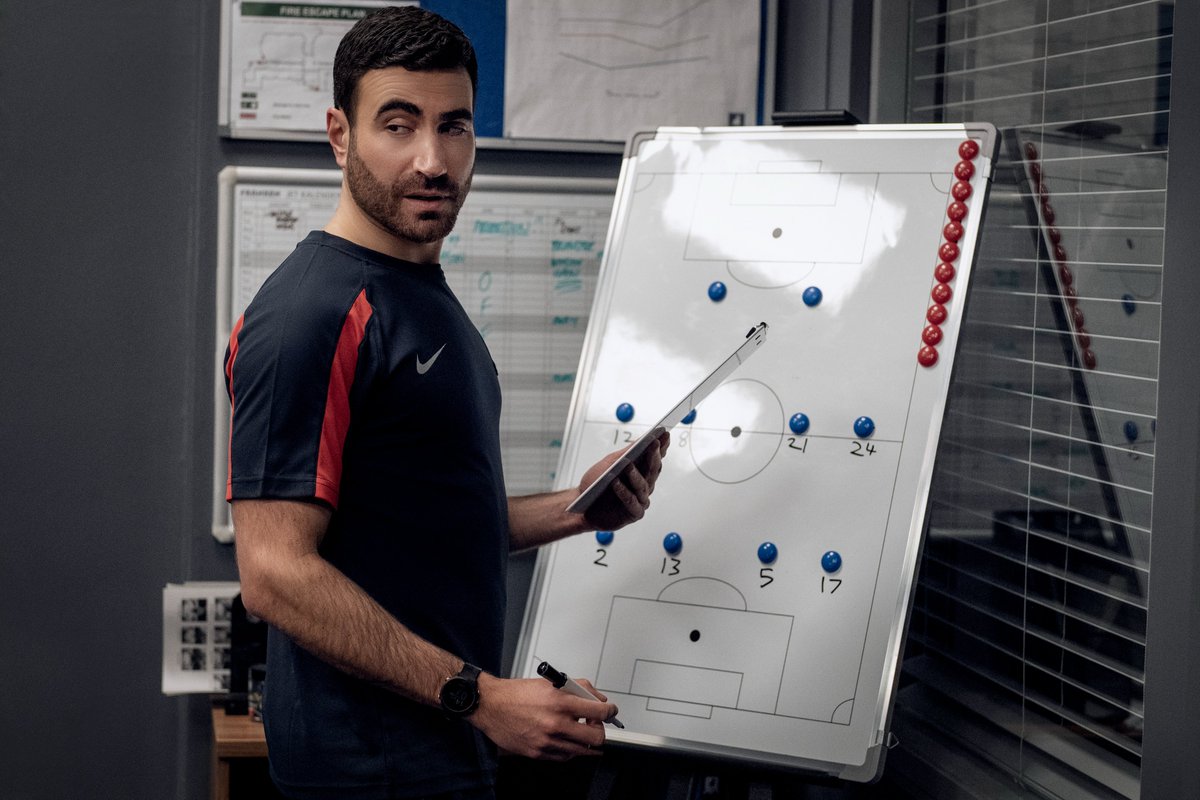 brettgoldstein's tweet photo. Ted Lasso Season 3 Ep 1 is on @AppleTVPlus. Written by the brilliant @Leann_Bowen. No spoilers but judging by these pictures, Beard is paranoid they're being watched, Roy does a lecture on blue dots, and Will learns how to hold bottles the right way up.

Let's go Greyhounds! https://t.co/AW5n3oEcez