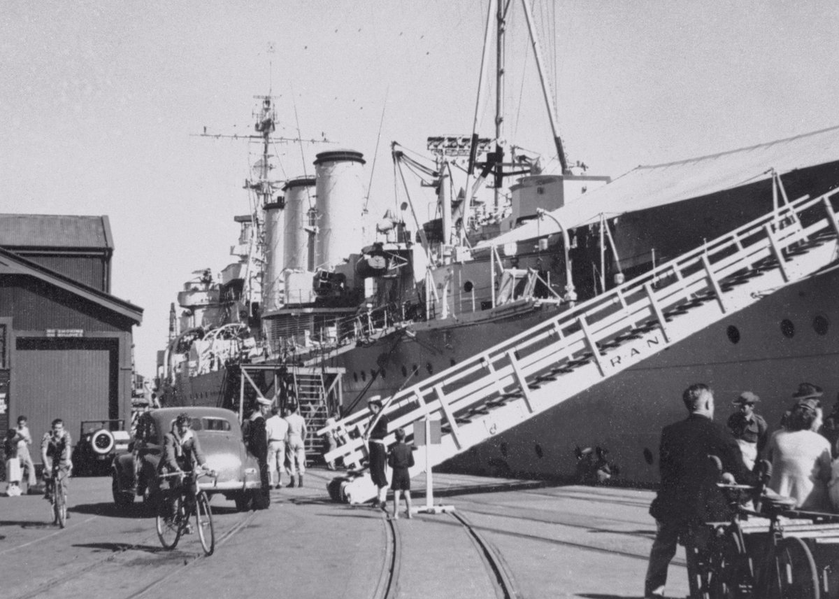 DramaWarship's tweet photo. Date: May 12, 1949. Location: Fremantle, Australia. Event: Heavy cruiser Australia makes a port call in Fremantle to greet Sydney, the first-ever aircraft carrier of the Royal Australian Navy. Current status: Scrapped in 1955-56, lifespan of 31 years. https://t.co/q6E3NIcYUj