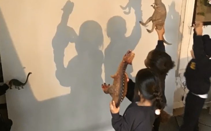 JoPetersEYFS's tweet photo. Children completely engrossed in the magic of light and silhouettes, manipulating shadows and movement. 100 languages are there #Malaguzzi @MossParkInf https://t.co/TH3cUErspI