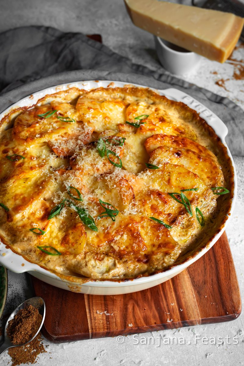 sanjanafeasts's tweet photo. Garam Masala Potato Gratin. The creamy sauce gets a boost of flavour from warming garam masala. I use both regular potatoes &amp; sweet potatoes. It’s not 🌶️ spicy but has a gentle, aromatic heat which is oftentimes just what’s needed. https://t.co/zPVRc8Wpit