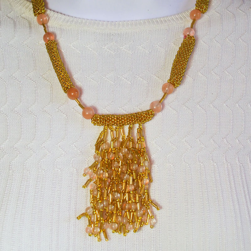 SandeeJene's tweet photo. Handmade Beaded Beads, branches, gold seed bead necklace. *Long peyote beaded beads handmade. *Bugle bead branches handmade. *Single strand pink rose Quartz bead accent. *size: 18 inch around the neck. *Buy Here//bit.ly/3i7NbWJ #JBSG #BeadedBead #necklace #GoldColor ... https://t.co/pHQHoPmKrU