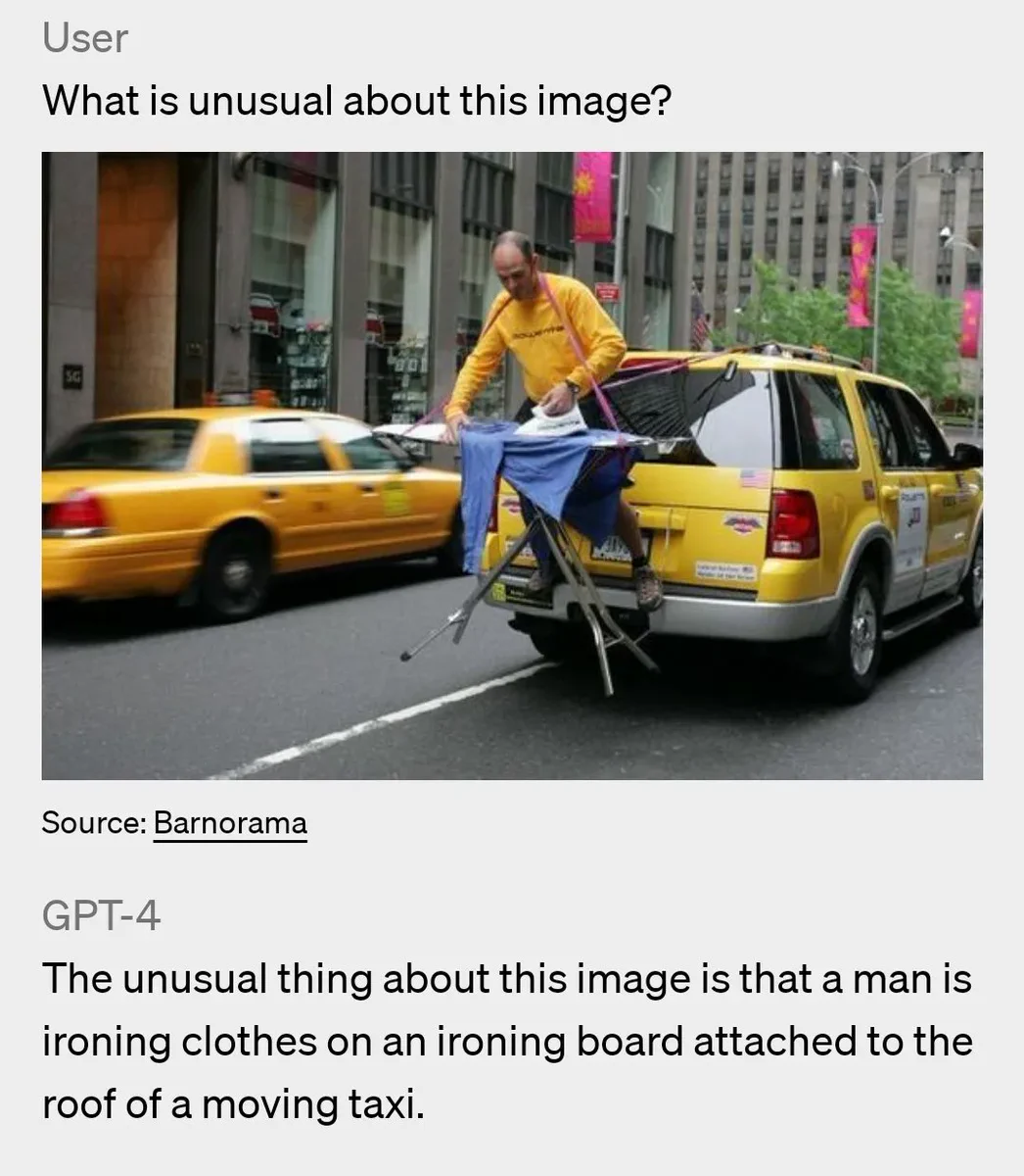 gpt4 explain what is unusual in an image of a man ironing from the back of a car
