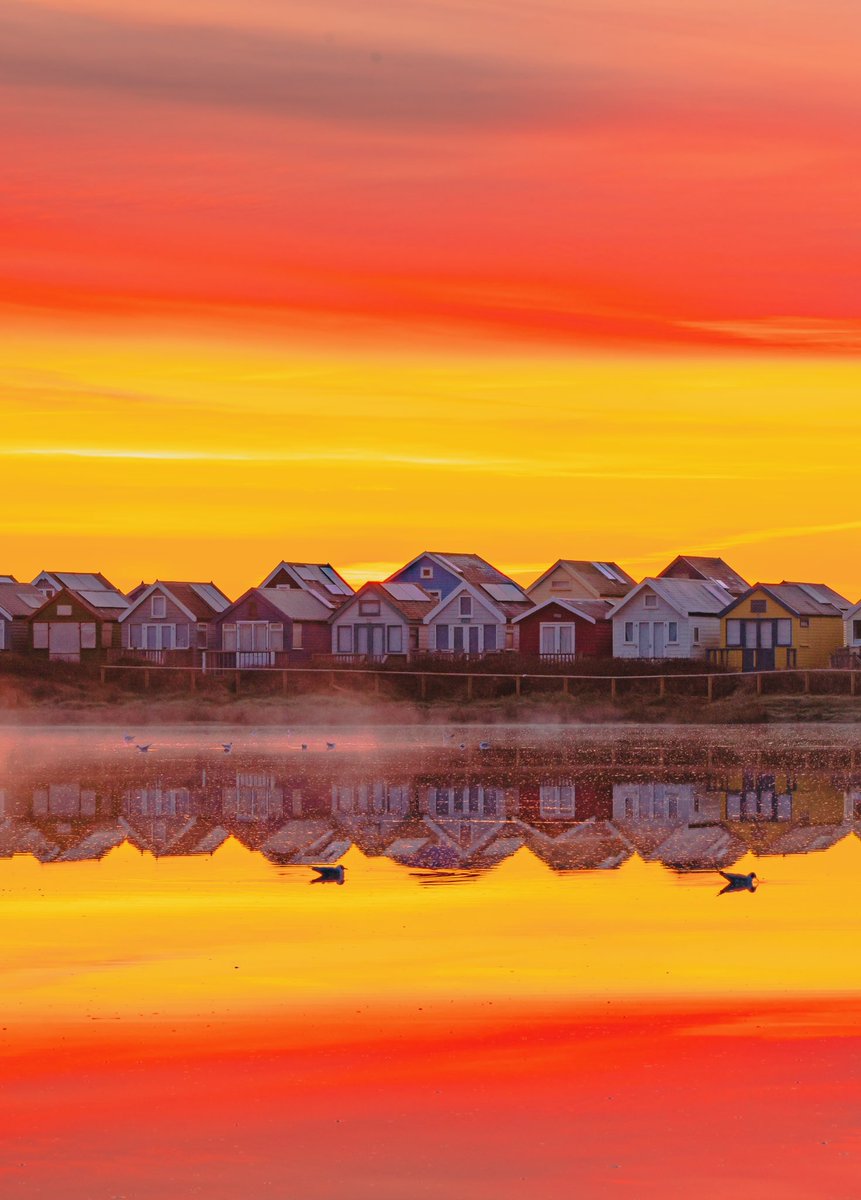 A touch of mist lovely reflections and colourful sunrise what more could I ask for this morning have a great day everyone #dorset #KingstonIsWithYou #sonyalpha #hengistbury #beachhuts #sunrise #mist #beachlife @StormHour @Sony @SonyUK @VisitSEEngland @DorsetMag