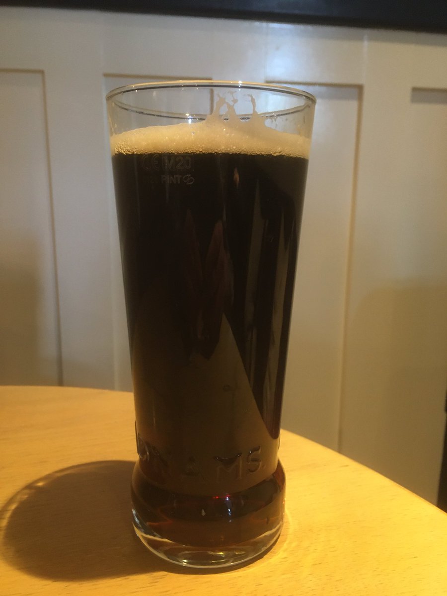 Enjoying an excellent <a href="/Adnams/">Adnams Southwold</a> Oyster Stout in the Swan Tap Room, Southwold.