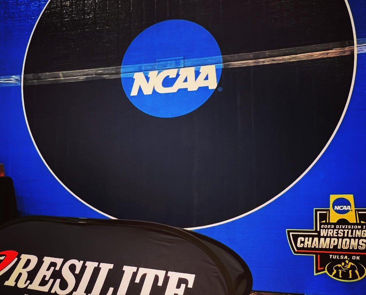 All dressed up and ready to go! Make sure to stop by our booth at FanFest and get your photo taken with a replica of the Finals mat! 📸 #NCAAWrestling