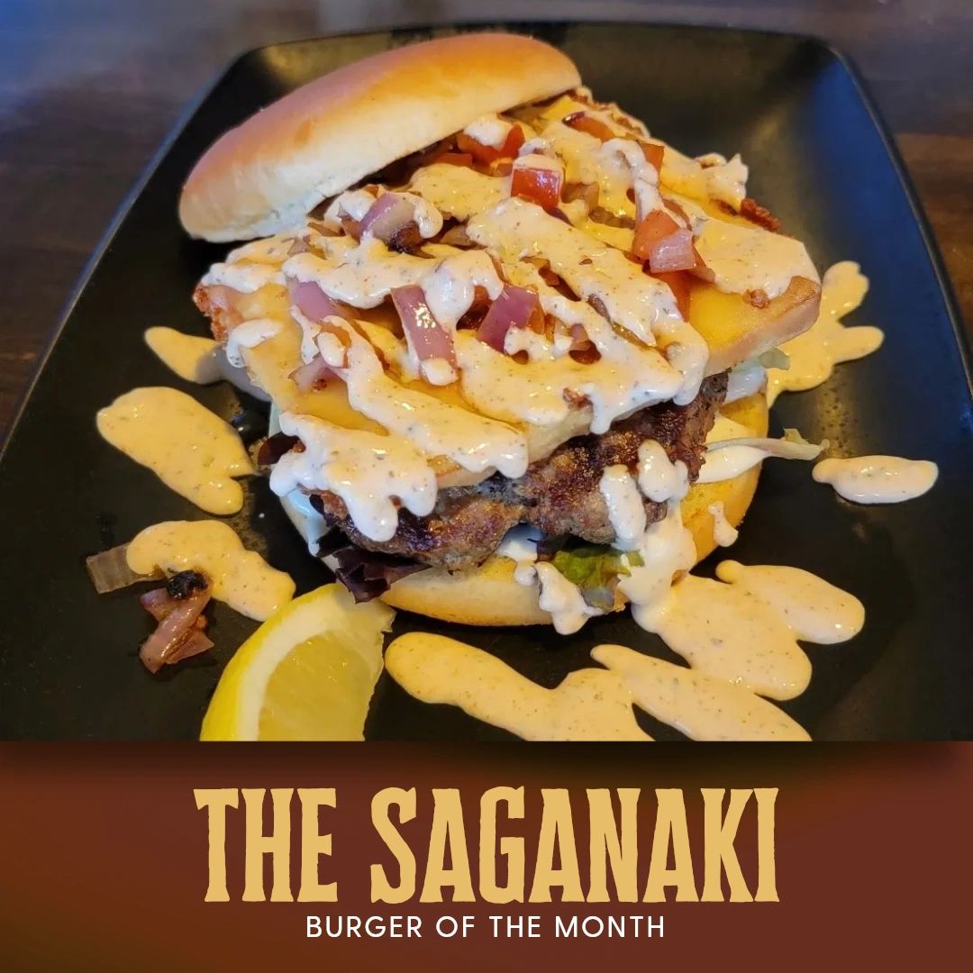 BackroadsPub's tweet photo. Have you tried The Saganaki, our burger of the month? This savory half-pound burger sits atop a bed of garlic aioli and crisp spring mix. It's topped with golden saganaki cheese, grilled tomatoes and onions, and a drizzle of our spicy Greek tzatziki sauce. https://t.co/PzkISY6Ljj
