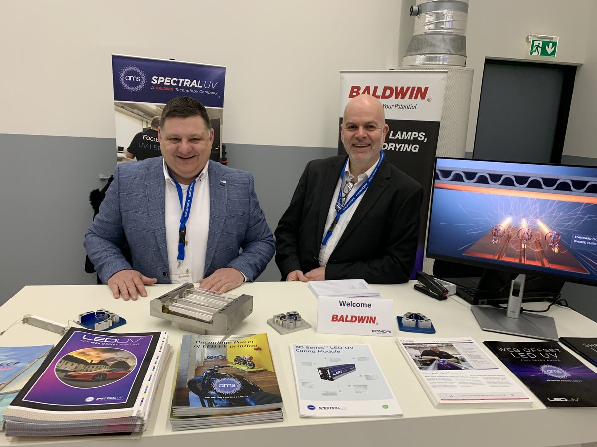 Baldwin_Corp's tweet photo. At Komori International Europe's open house? Visit Christian Schreiber and Lee Simmonds for the scoop on our optically enhanced #LEDUV and height-adjustable IR/HA dryer optimized for Komori presses that take energy savings and performance to a new level. 
#uvled #irdrying #komori https://t.co/r3YnBFhbvZ