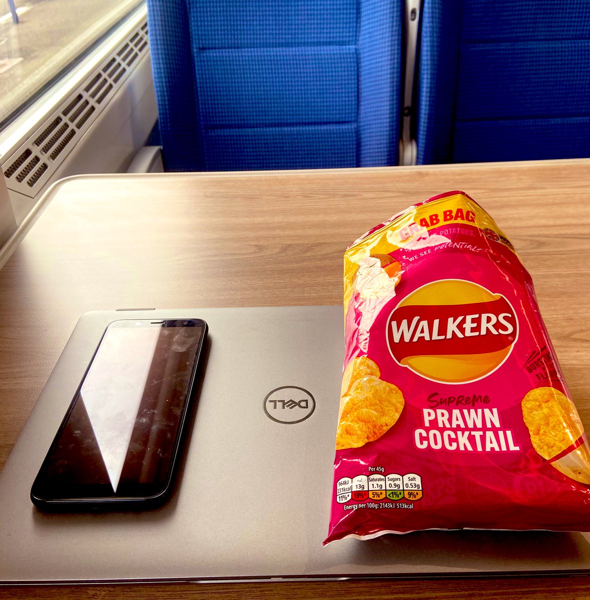 Travelling back from Scarborough after a lovely client meeting with <a href="/patrickboydcm/">Patrick Boyd</a> and John of the <a href="/irwinmitchell/">Irwin Mitchell</a> Asset Management team.
A little bit more work on the way home whilst enjoying a ‘train ride essential’ which is always a giant bag of Prawn Cocktail Walkers!