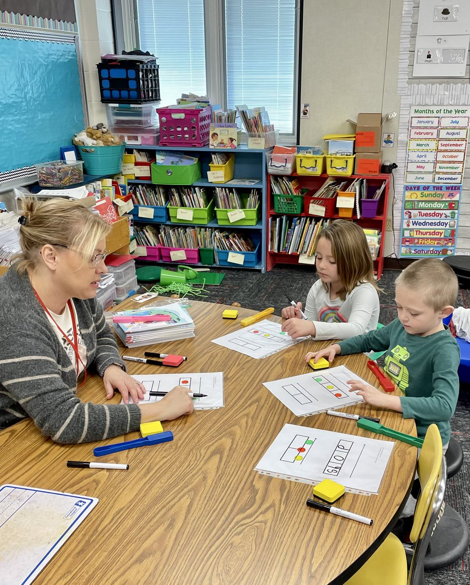PCS_Pride's tweet photo. Kindergarten Reading:
Mrs. Hutcheson is working with small groups. Students are using Elkonin boxes to break words apart, write the word and then blending words back together using magnetic chips and magnetic wands.
#ScienceOfReading
#WhyWeDoWhatWeDo
#BestTeachingPractices https://t.co/AtiLGMsO12