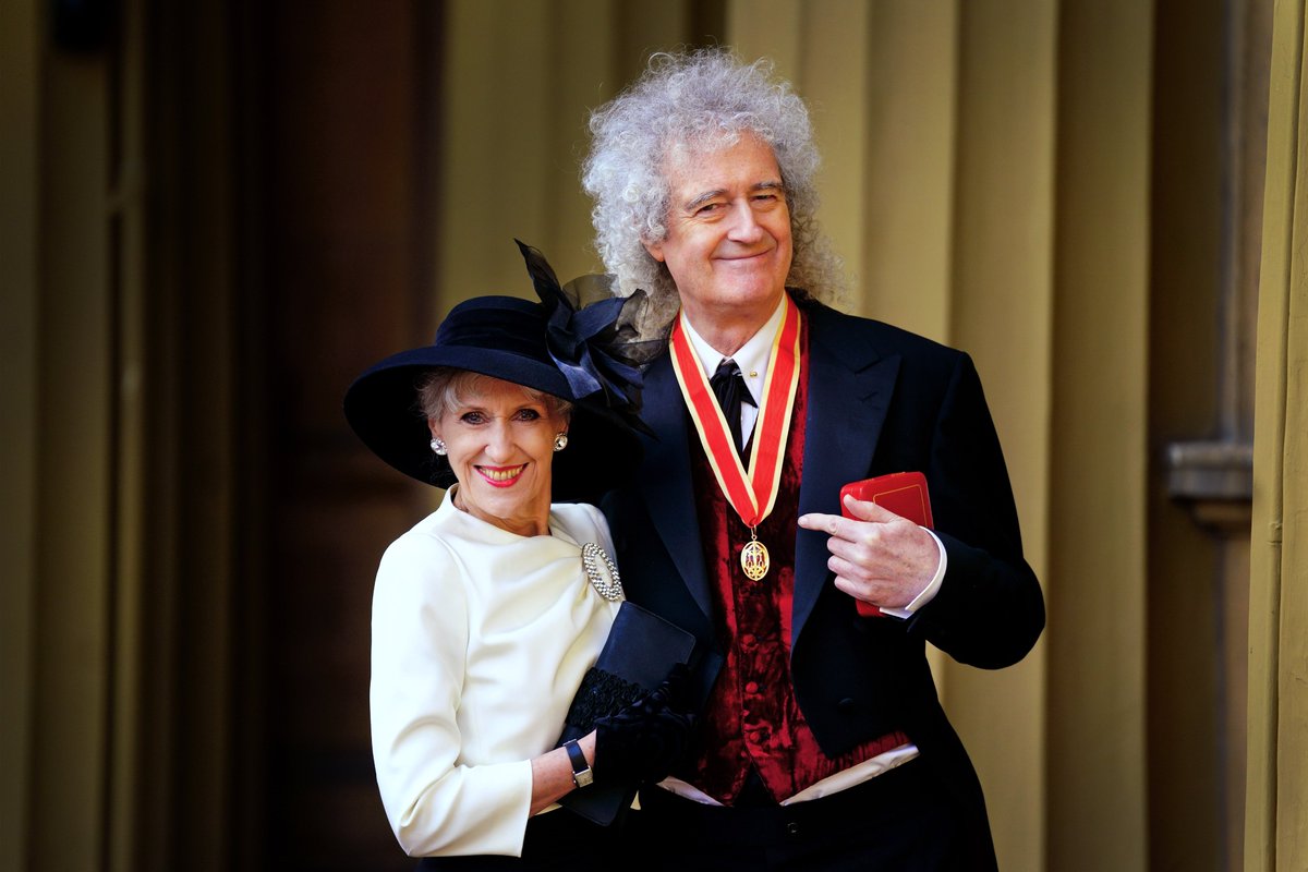 Sir Brian May <a href="/DrBrianMay/">Dr. Brian May</a> poses with his wife Anita Dobson after being made a Knight Bachelor by King Charles III during an investiture ceremony at Buckingham Palace for services to music and charity. Picture date: Tuesday March 14, 2023. Picture credit: Victoria Jones/PA Wire