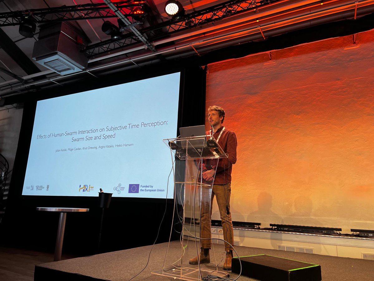 Julian presented his work “Effects of Human-Swarm interaction on subjective time perception: Swarm size and speed” <a href="/HRI_Conference/">The HRI Conference</a> #HRI23moment #HRI23 #ChronoPilot <a href="/SwarmDynamics/">Heiko Hamann</a> <a href="/ArgiroVatakis/">Argiro Vatakis</a> <a href="/mugecavdan/">müge Ψ</a>