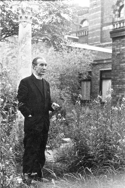 GroomB's tweet photo. Father Crowley in the overgrown garden at St Philip Neri Church, Liverpool 8, 1972, by Tricia Porter. https://t.co/KY5hkeKZd7