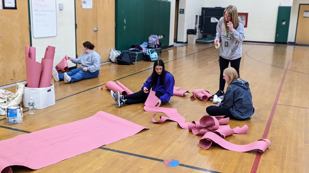 Group effort this afternoon adding four new yoga pose silhouettes to the walls of Doyle Gym! Love this crew!