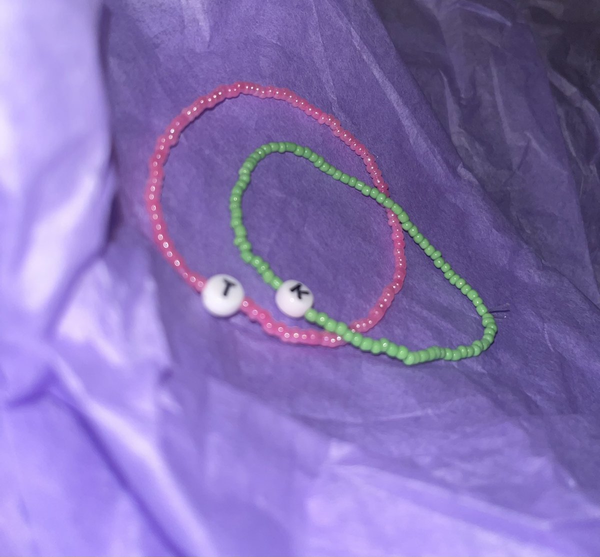 These are a few samples of the single/multi-colored initial beaded bracelets I make, these are fully customizable so if you are interested in looking and/or buying check out uniquebeadeddesignss.etsy.com🤍🗣