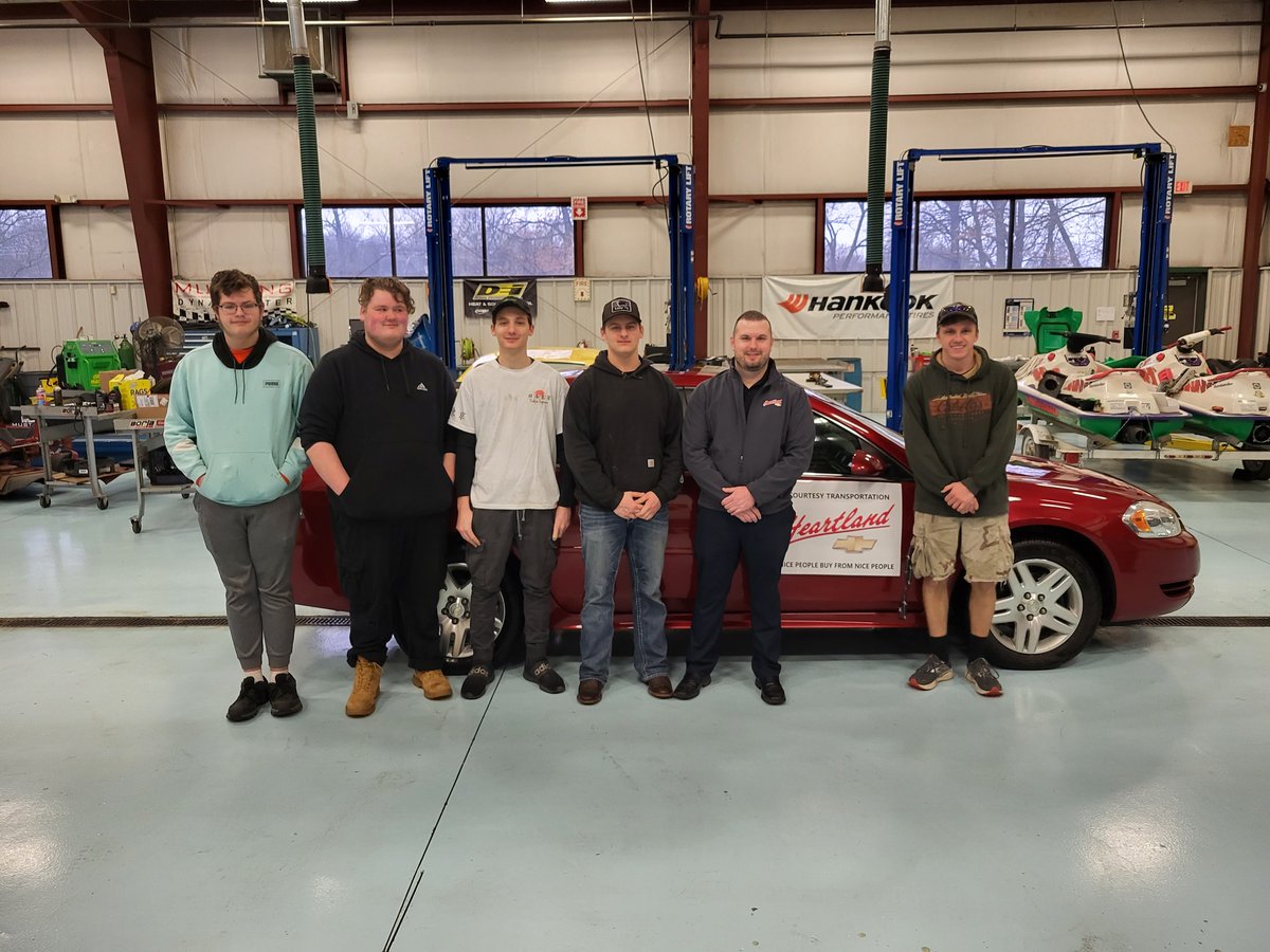 NKCSchools's tweet photo. Surprise! Johna Fox, a dedicated district parent, drove home today in a new car! Thanks to partners @HeartlandChevy_, @DiscountTire, &amp; @oreillyauto,  along with the hard work of our @CtecAutoTech, this @NKCFood employee has a safe vehicle for her family. https://t.co/8flo2AcFLD