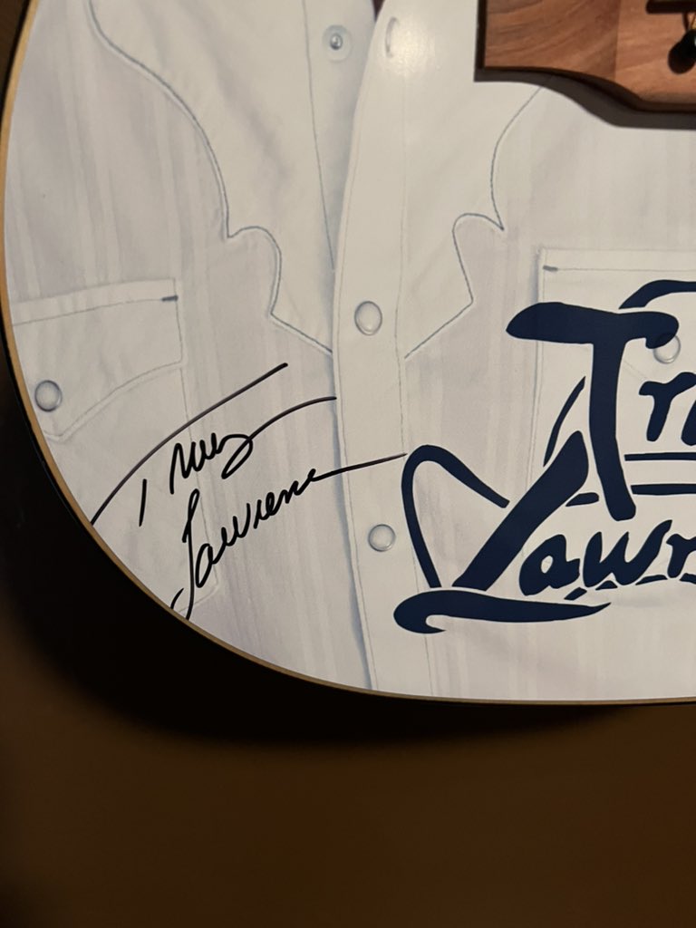 Bought a signed guitar at Tracy Lawrence/clay Walker show in Enid, OK and got it home to find part of the signature is cut off. Having paid $500 for a signed guitar it sucked to find the signature flawed after getting home. <a href="/tracy_lawrence/">Tracy Lawrence</a>