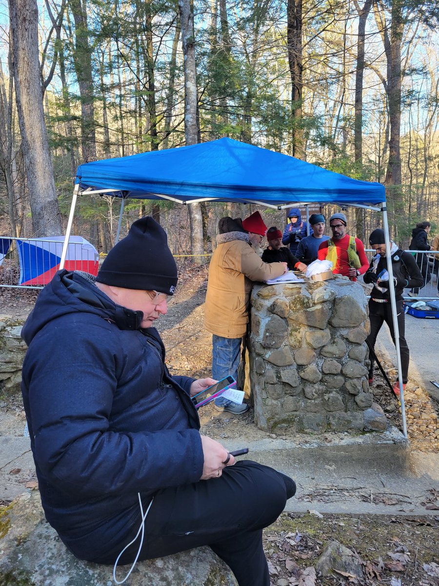 Multiple phones in hand, <a href="/keithdunn/">Keith</a> works as hard as anyone at this race who isn't actually running. #BM100