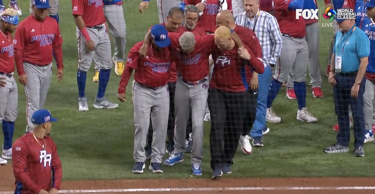 BRWalkoff's tweet photo. Edwin Diaz appears to go down with an injury during Puerto Rico’s celebration https://t.co/oYjwSD5bjQ