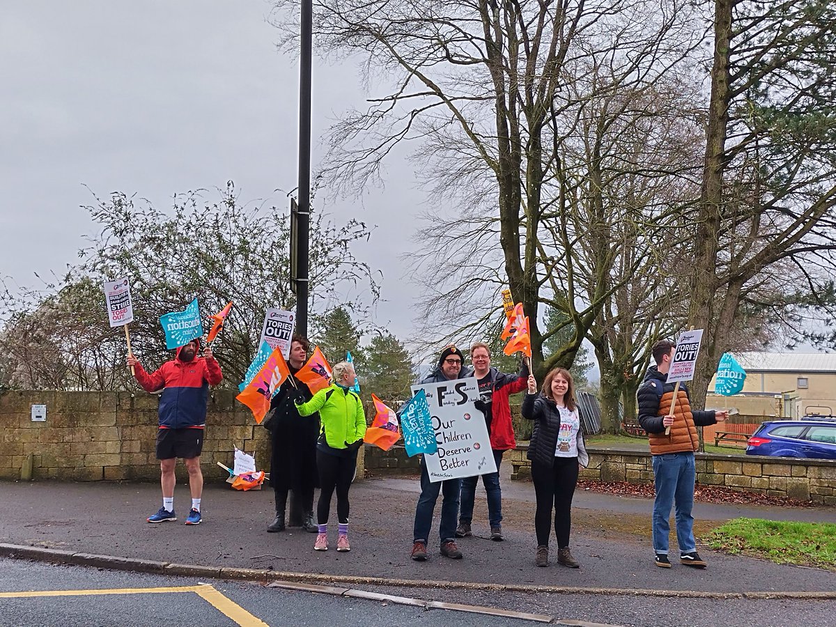 NEUSouthWest's tweet photo. In good spirits at a wet and windy picket at Ralph Allen School, Bath https://t.co/zgcFgdaigb