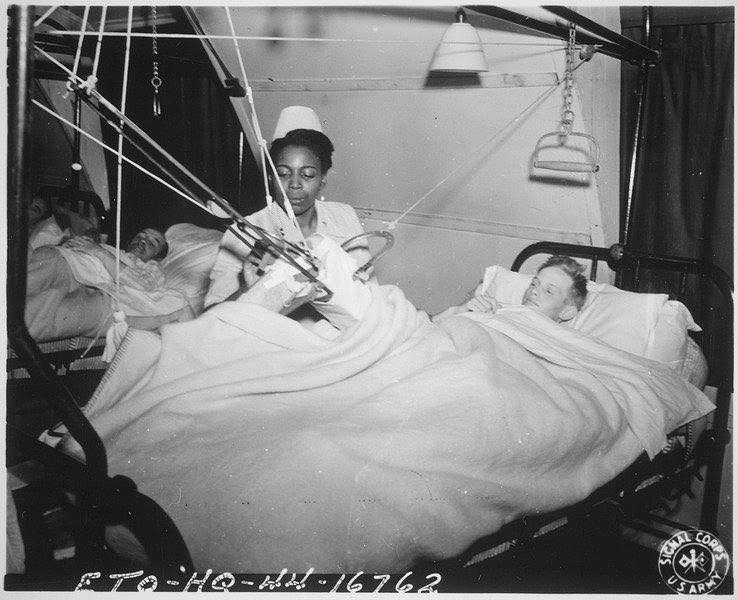 US Army nurse Lt. Florie E. Gant tending a prisoner-of-war patient, England, 7 Oct 1944 (US National Archives) #histmed #histnurse #historyofmedicine #historyofnursing #militarymedicine #pastmedicalhistory