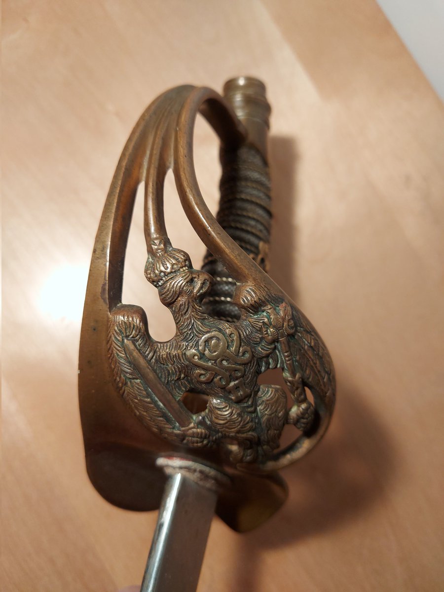 Fatman1460's tweet photo. Well my first blade is finally here. An M1889 Prussian infantry officer sword with scabbard. The grip is wire wrapped shark skin with the royal cipher of Kaiser Wilhelm ii. A beautiful decorative guard of the Prussian eagle. #imperialgerman #Prussian #sword #militaria #collector https://t.co/UND2zg5mQb