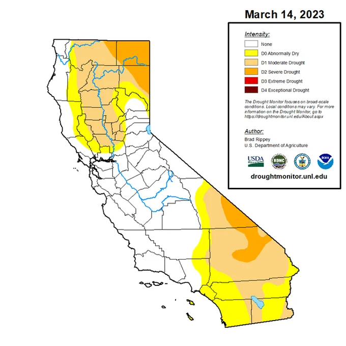 Drought monitor map from March 14, 2023 showing the state of California with the northern and southern thirds of the state in at least D0 (abnormally dry), with smaller areas in D1 (moderate drought) and D2 (severe drought), and the Bay Area largely removed from all drought categories with the exception of portions of northeast Sonoma and northern Napa counties, which area in D0 (abnormally dry).