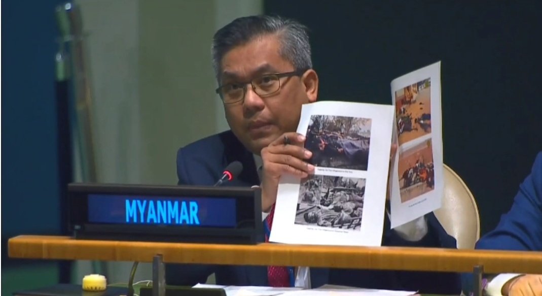 MayWongST's tweet photo. #Myanmar civilian #UN representative @KyawTun62907405 shows pictures of latest murder of more than 20 people in Southern #Shan state, said to be done by #military, to show UN "how serious the situation in Myanmar is". https://t.co/nUMLlgcnnC #WhatsHappeningInMyanmar 1/4 https://t.co/5vUmwz0r3h