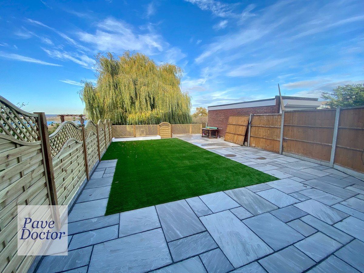 PaveDoctor's tweet photo. A lovely view across the reservoir from this garden. We used natural grey Indian sandstone slabs, new Neris fence panels, artificial grass and a concrete base ready for a new summer house/ office room to be installed.

#PaveDoctor
#chingford
#patio
#slabs
#indiansandstone https://t.co/tmFsYYmsig