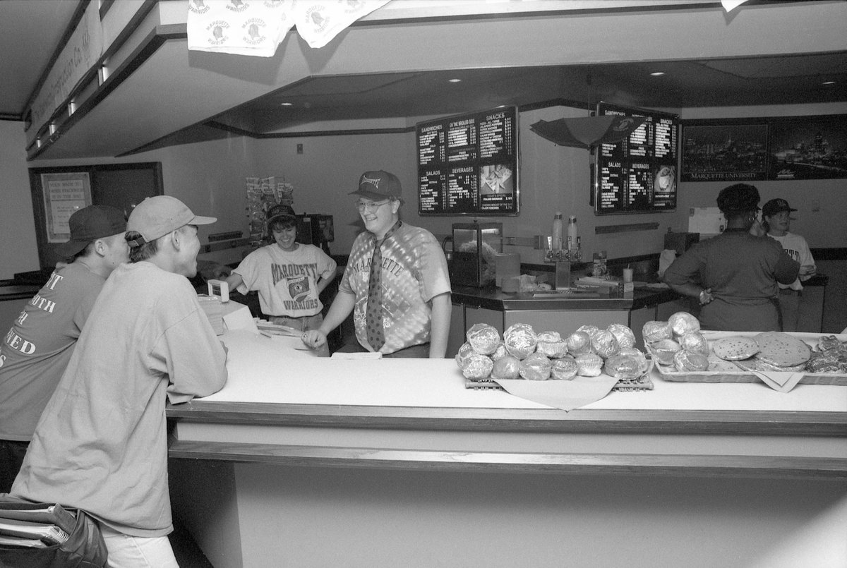 Students and staff enjoy a good time at The Pub in the Alumni Memorial Union, which offered short order menu items along with a selection of beer and wine in 1993.
- MU Archives