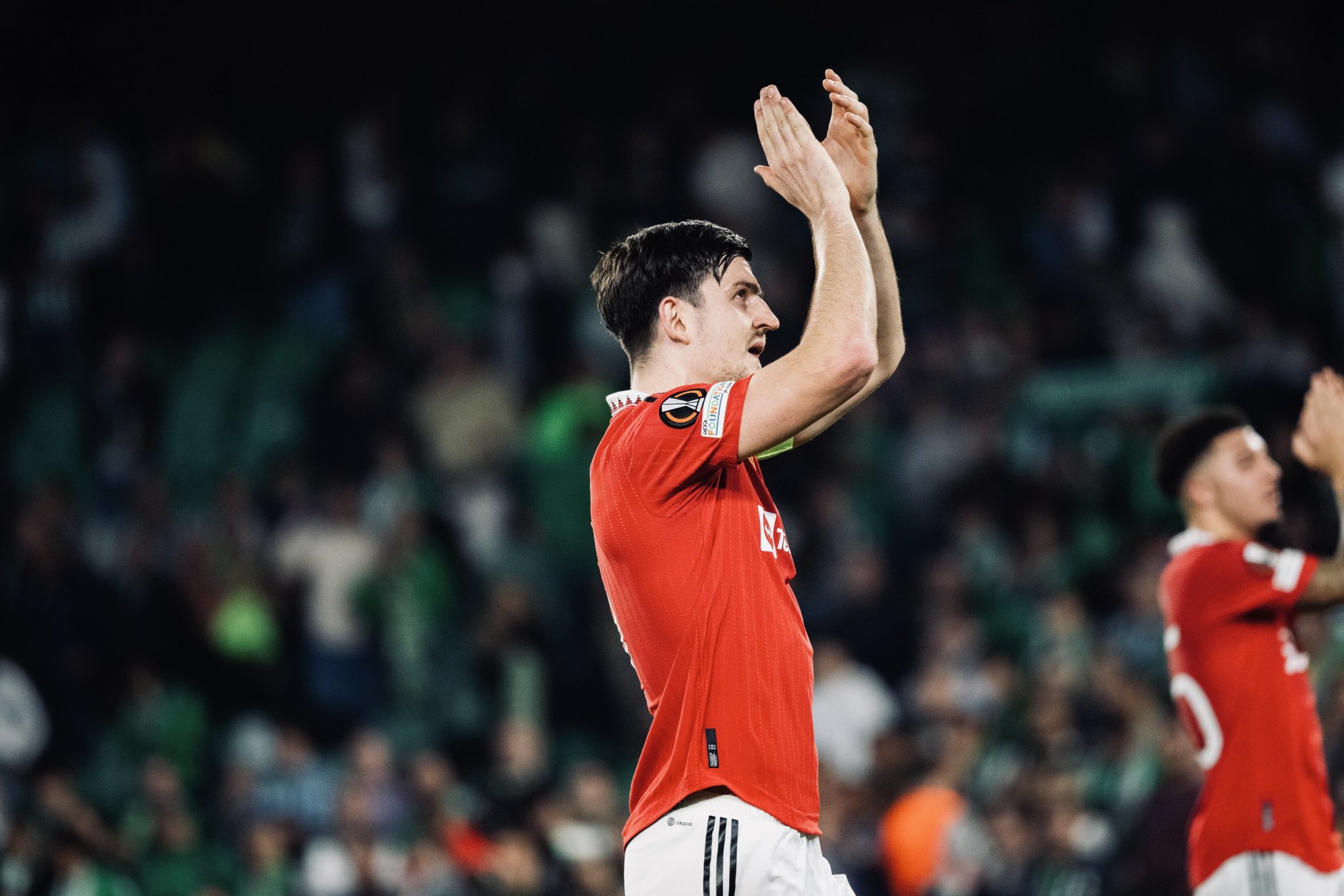 Harry Maguire applauds our fans after the game.