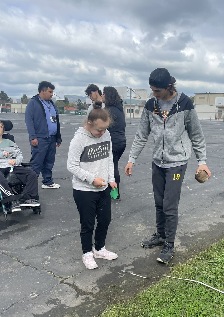Cloudy Weather doesn’t bring us down! Peer leader Nico shows Unified Pioneers athletes how to Shot Put <a href="/SimiValleyHS/">Simi Valley High</a> first annual track meet against <a href="/TheRoyalHS/">Royal High School</a>