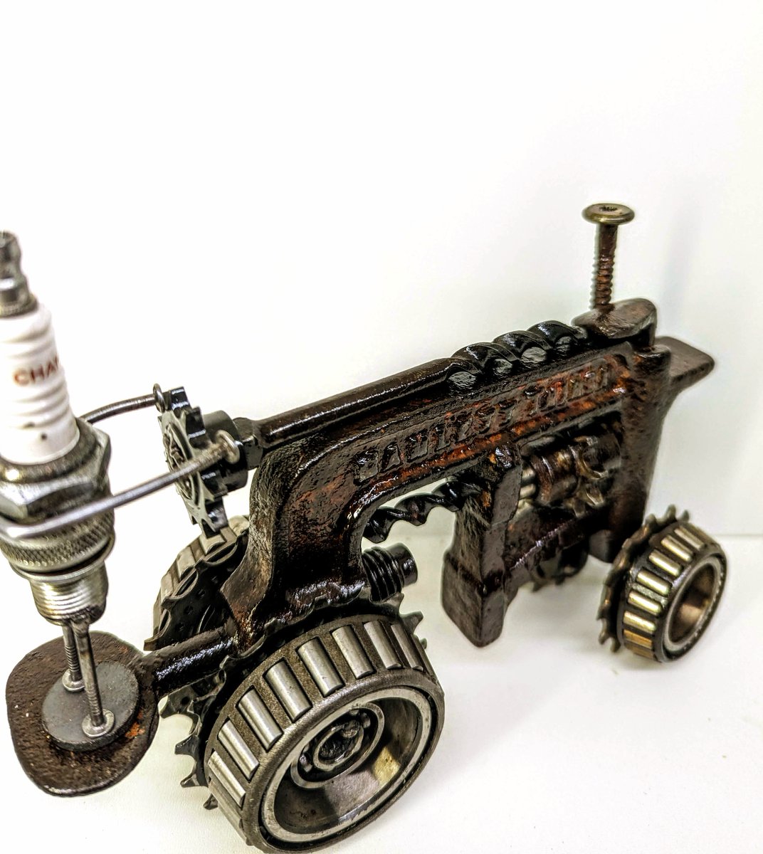 Here's a cool one for all you tractor lovers out there, this is an old school tractor made from an old vintage clamp. #earlybiz #vintage #tractor #machinery #handmade #SmallBiz #recycled #repurposed